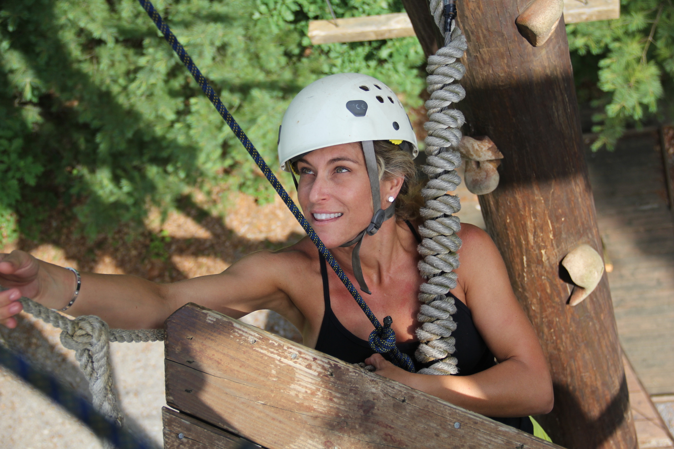 woman-climbing-adventure-course