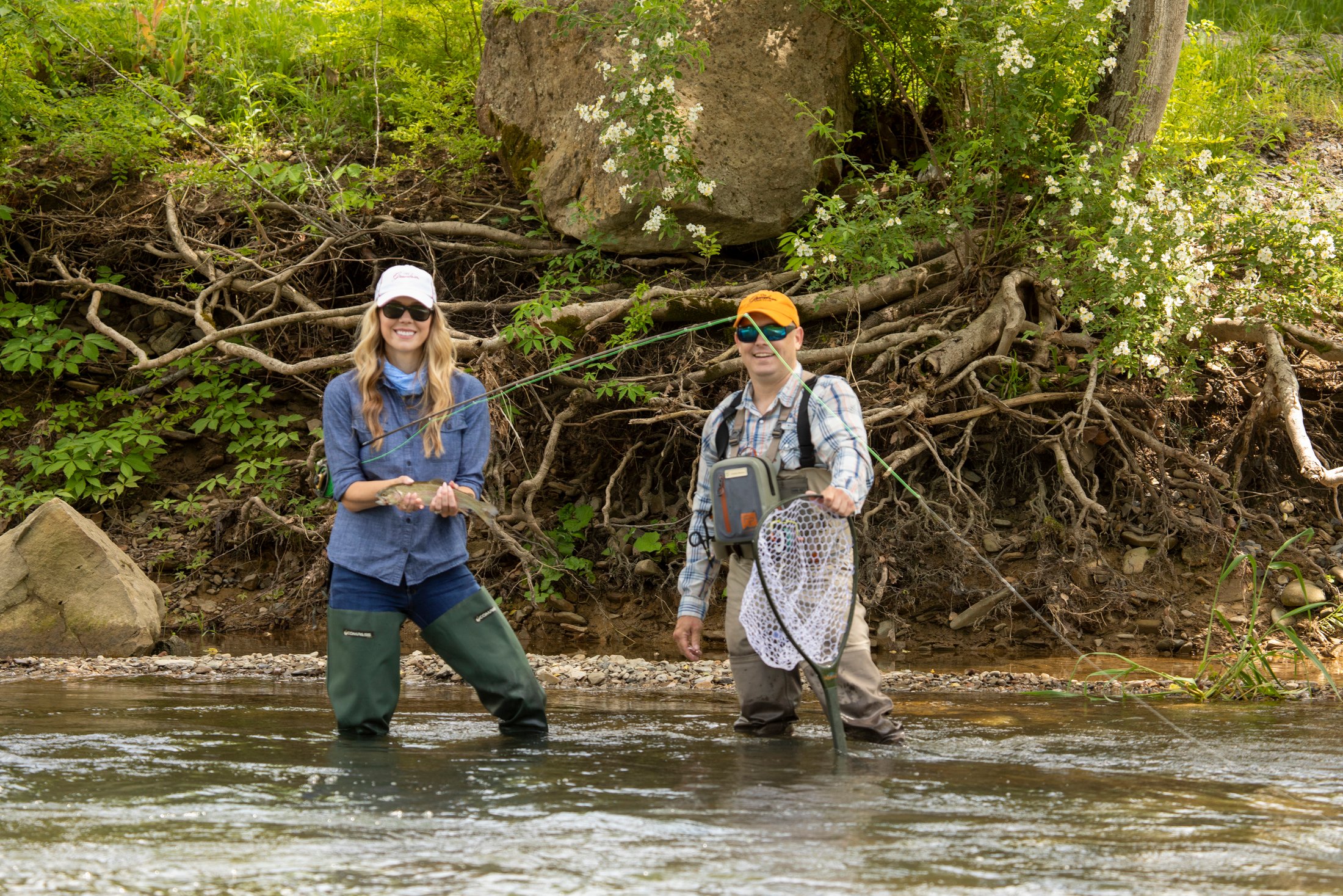 man-and-woman-fishing-in-river