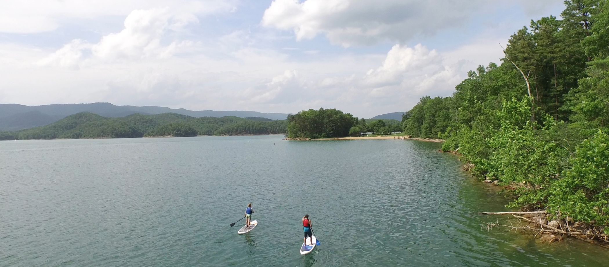 two-people-paddle-boarding