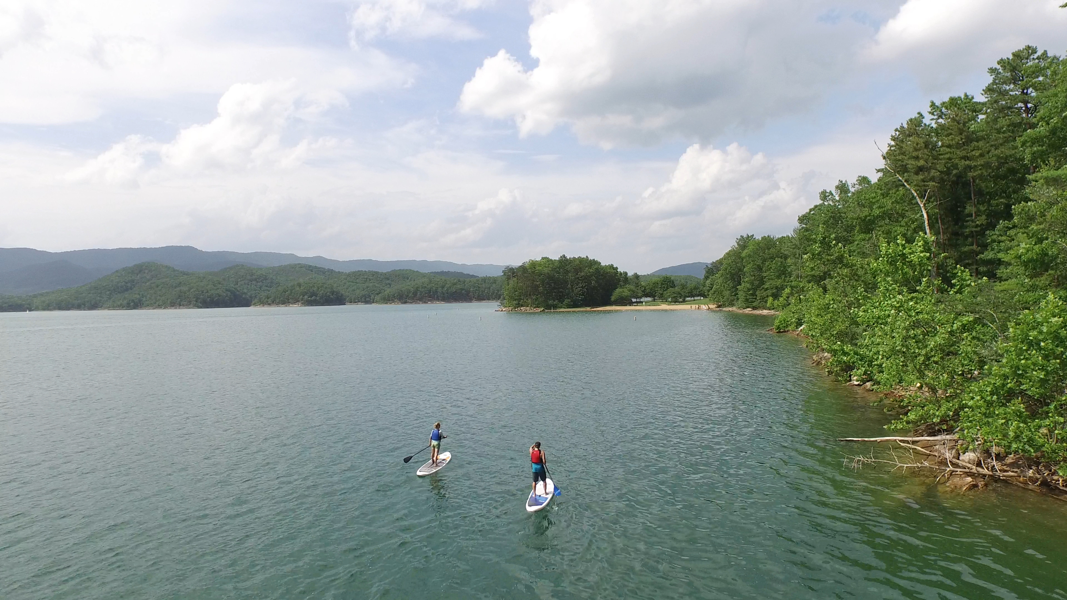 two-people-paddle-boarding