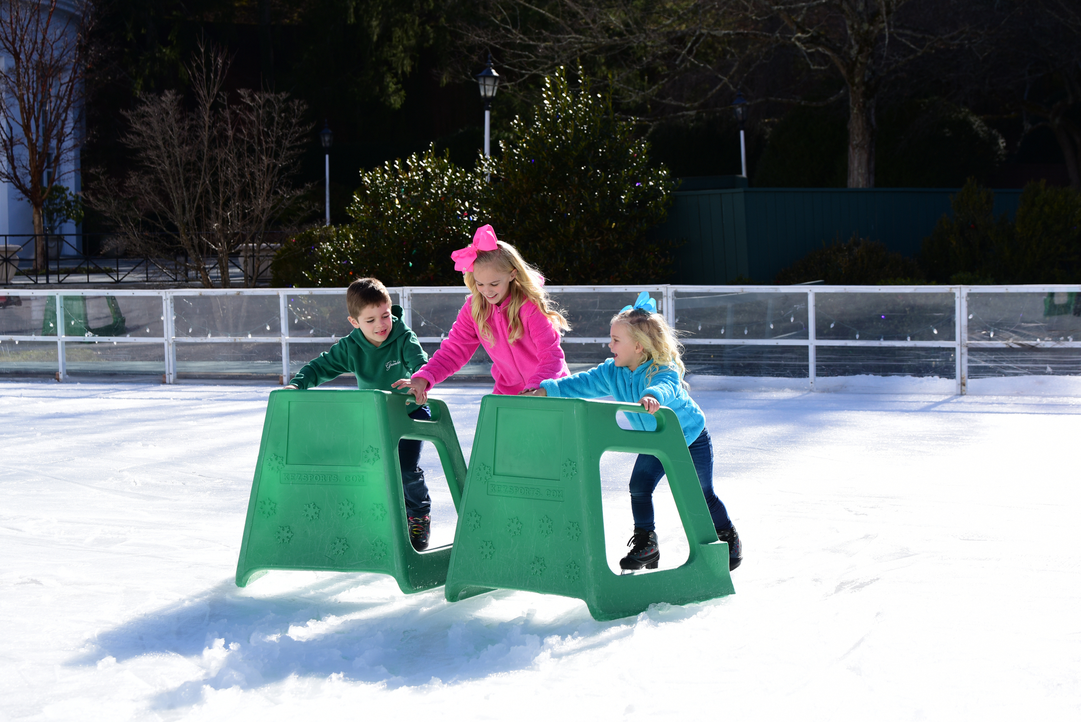 children-skating-with-helper