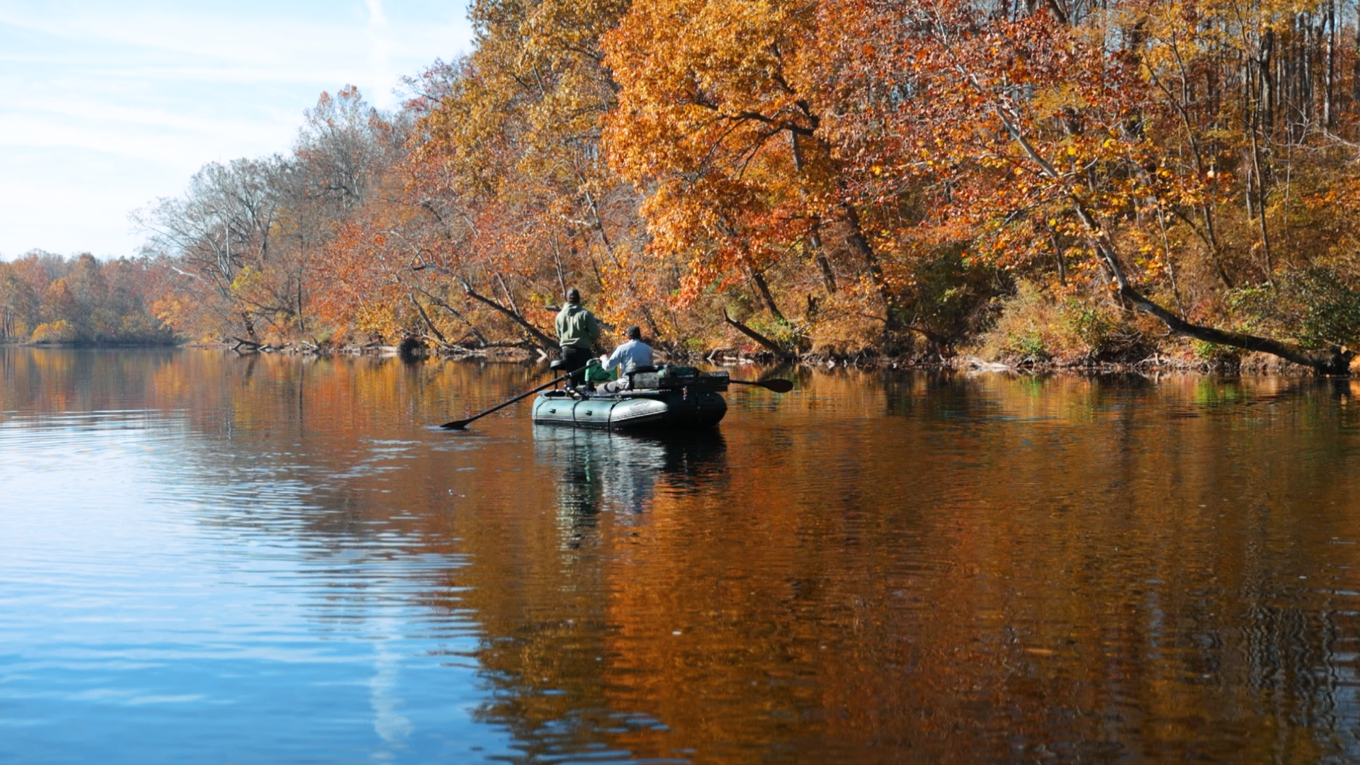 fishing-boat-in-river-fall-leaves
