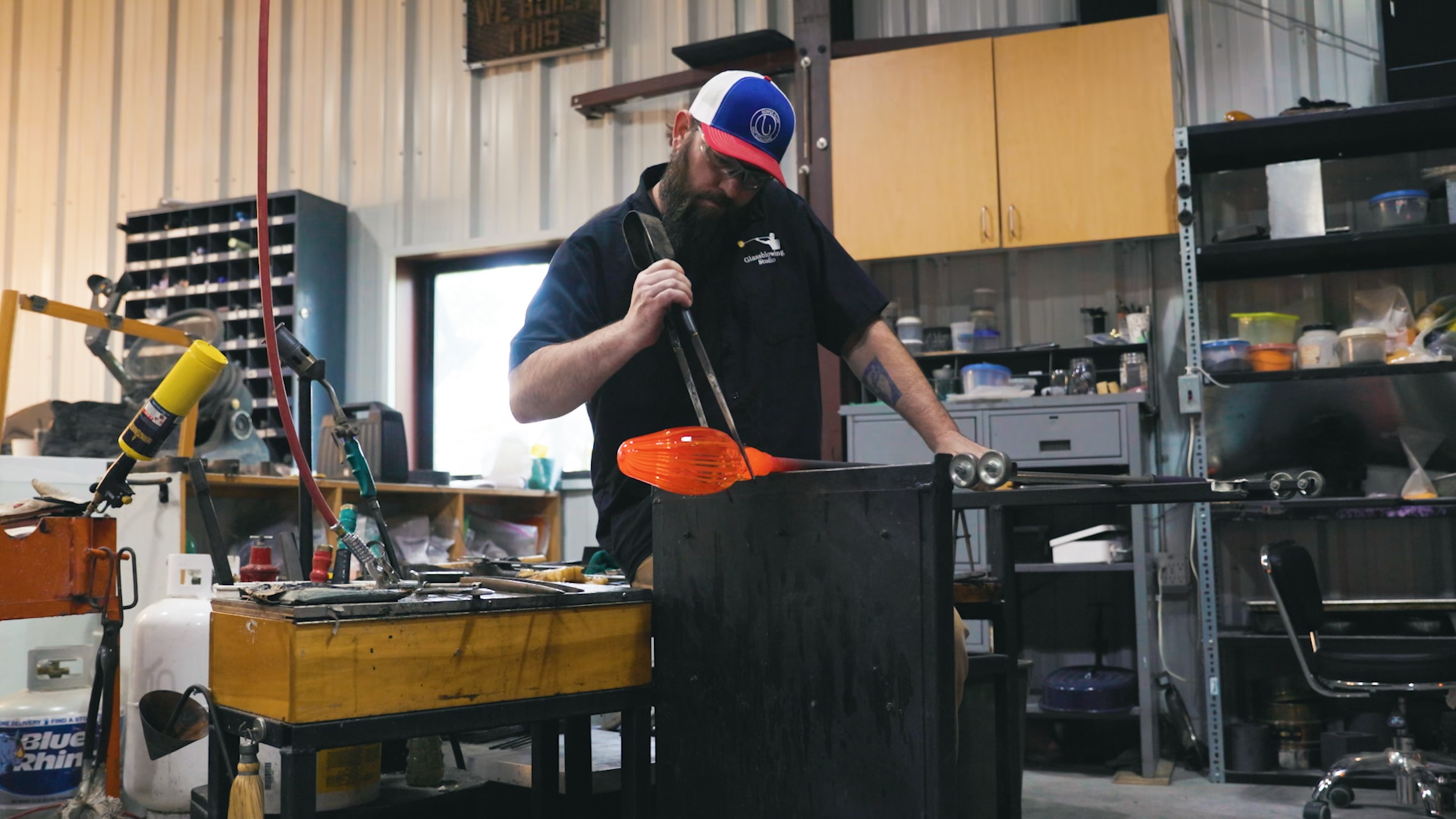 man-blowing-glass