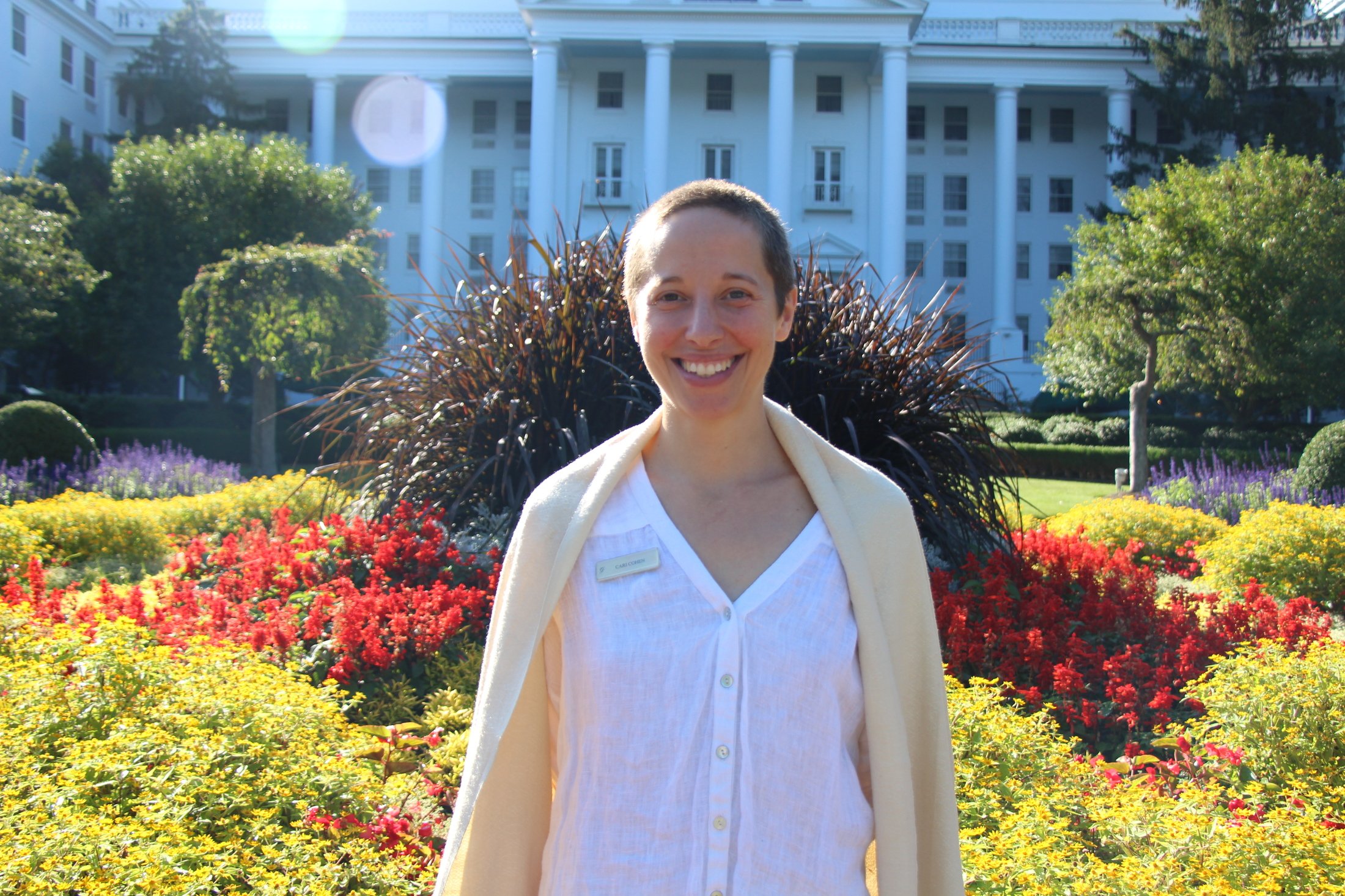 person-in-front-of-hotel-and-plants