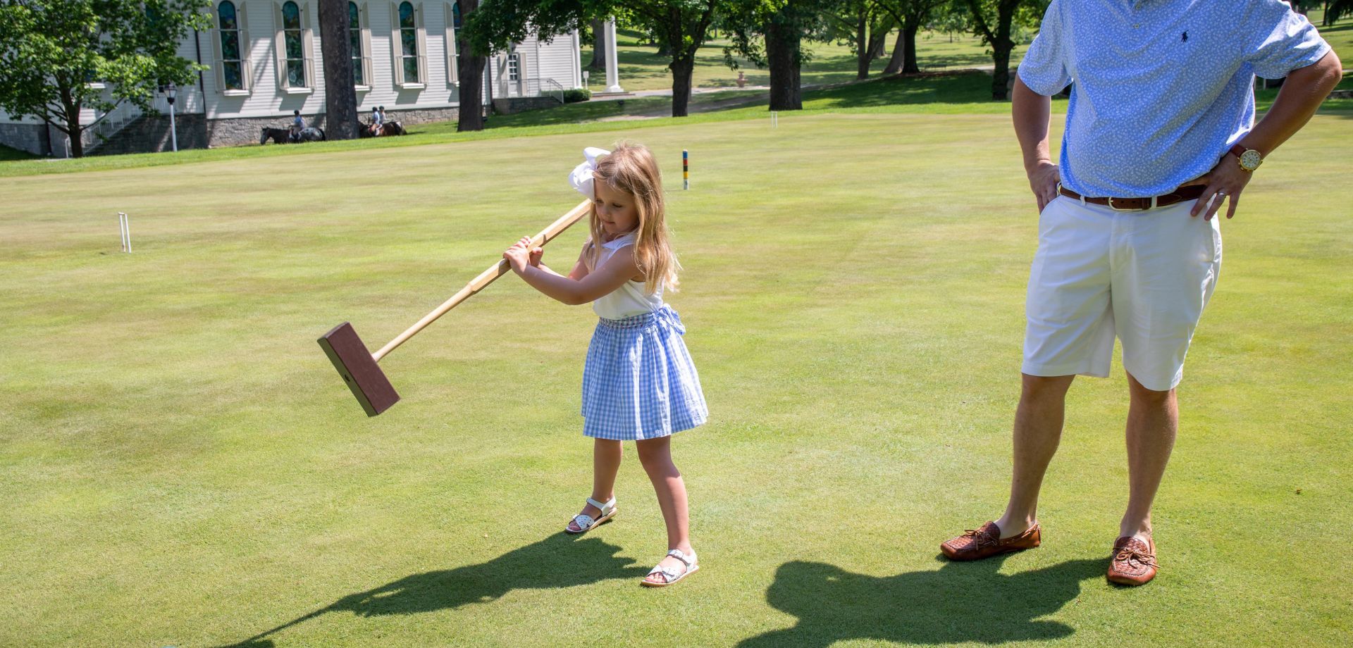 Child playing croquet