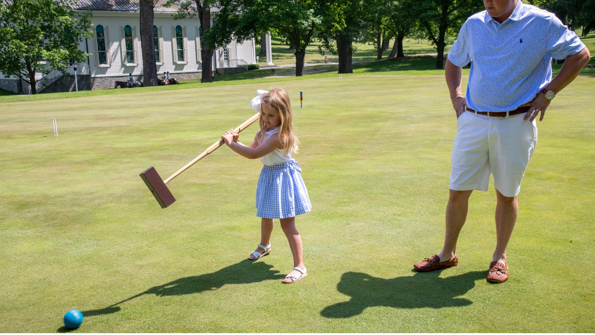 Child playing croquet