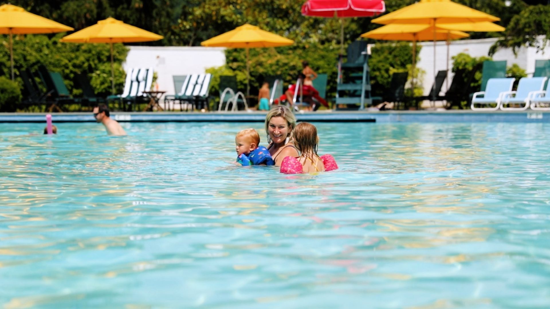 Family in outdoor pool